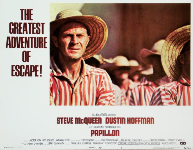 Original vintage US cinema Lobby Card for 1973 hit movie, Papillon, starring Steve McQueen and Dustin Hoffman, measuring 11 ins by 14 ins