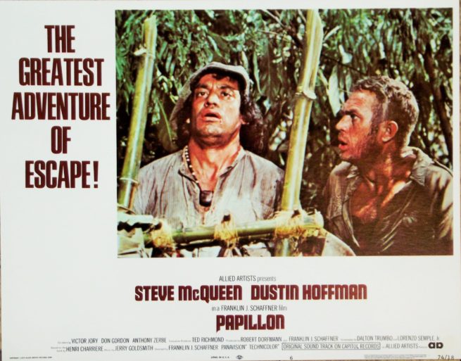 Original vintage US cinema Lobby Card for 1973 hit movie, Papillon, starring Steve McQueen and Dustin Hoffman, measuring 11 ins by 14 ins